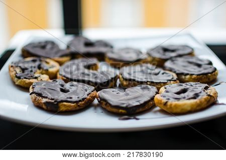 Homemade pastry puff chocolate cookies. Spanish dessert known as Palmeras de chocolate