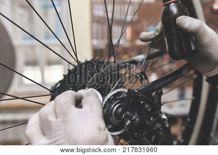 Repair technician bicycles was repaired gear bike shop. Bike Mechanic.