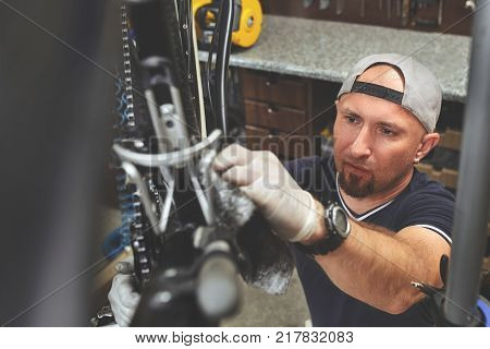 Repair technician bicycles was repaired gear bike shop. Bike Mechanic.