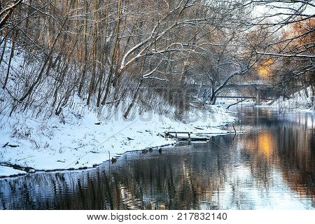 Scenic view of the river and trees covered by snow.