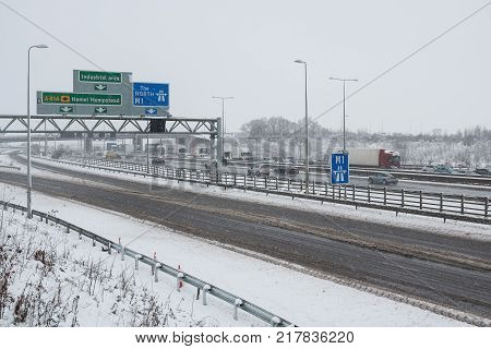 Hemel Hempstead UK - December 10 2017:Traffic on the British motorway M1 during the snowstorm