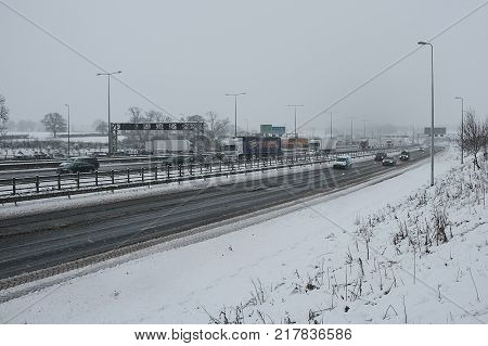 Hemel Hempstead UK - December 10 2017:Traffic on the British motorway M1 during the snowstorm
