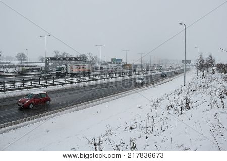 Hemel Hempstead UK - December 10 2017:Traffic on the British motorway M1 during the snowstorm