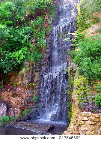 Beautiful waterfall flowing at Krape Park in northern Illinois