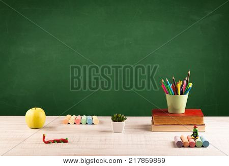 Back to school concepty with clear blackboard background, desk, items