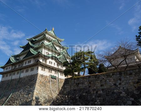 The Main Tower (tenshu) Of Nagoya Castle Over Blue Sky