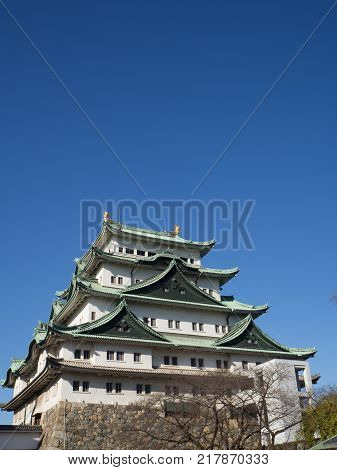 The main tower (Tenshu) of Nagoya Castle over blue sky