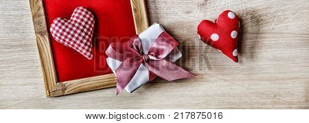 Valentine's Day Background hearts homemade gift box and red frame with free space for text. top veiw
