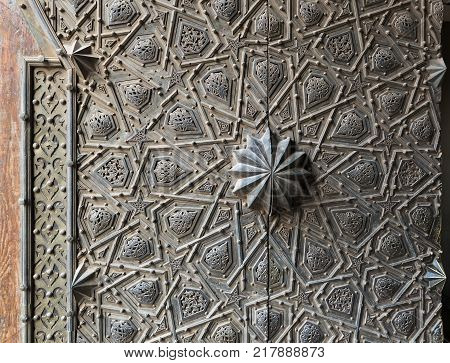 Cairo, Egypt - December 2, 2017: Ornaments of the bronze-plate ornate main gate of Manial Palace of Prince Mohammed Ali Tewfik