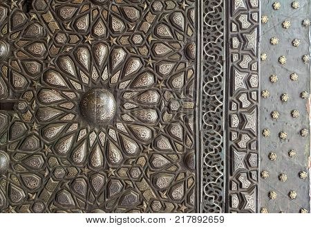 Cairo, Egypt - December 2, 2017: Ornaments of the bronze-plate ornate door of the residence hall of Manial Palace of Prince Mohammed Ali Tewfik