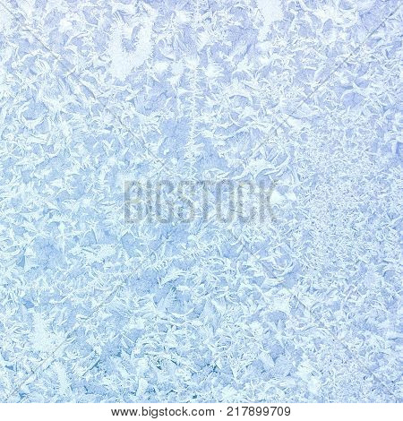 Texture pattern. Frozen water on the glass frozenned glass Ice on windowwinter icy patterns.