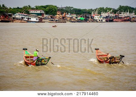 two boats in the Yangon river, they transport between Yangon and Dala, Myanmar, May-2017