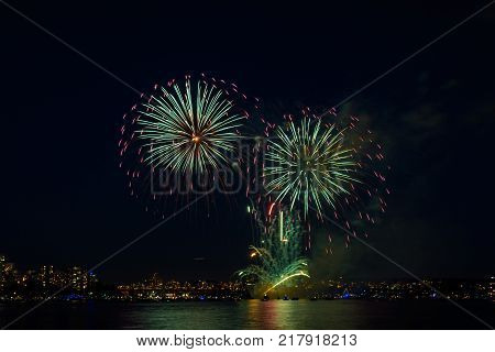 Celebration multicolored fireworks copy space. Canada Day holidays salute. New Year celebration colorful fireworks.