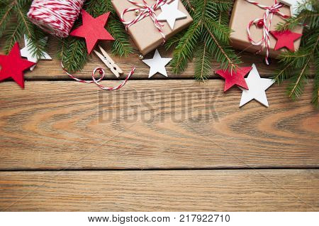 Christmas gift boxes and decorations on wooden background