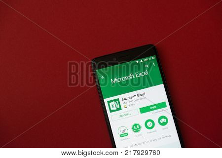 Los Angeles, december 11, 2017: Smartphone with Microsoft Excel application in google play store on red background