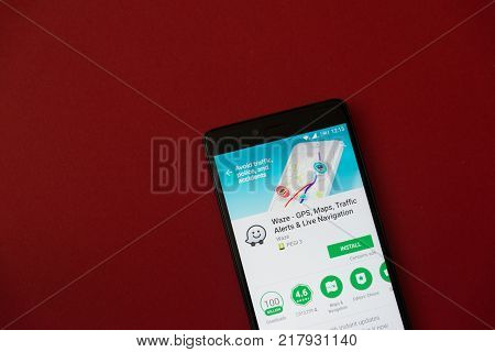 Los Angeles, december 11, 2017: Smartphone with Waze application in google play store on red background