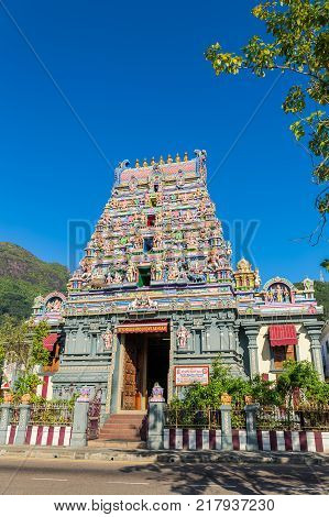 Colorful facade of a Hindu temple in Victoria Mahe Seychelles also known as ARUL MIHU NAVASAKTHI VINAYAGAR. Vertical composition