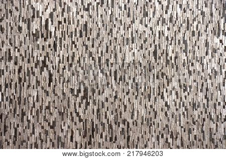 Decorative brick wall from concrete facing tiles as background or texture.