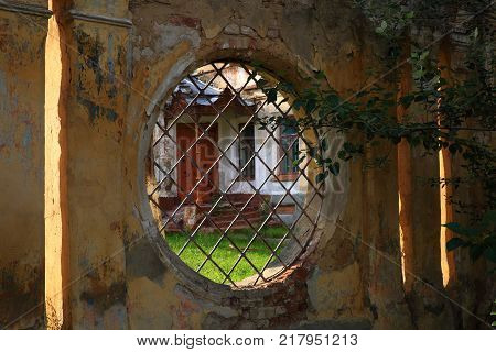 A view of the city wall with a round opening in the ancient Russian town of Yelets.