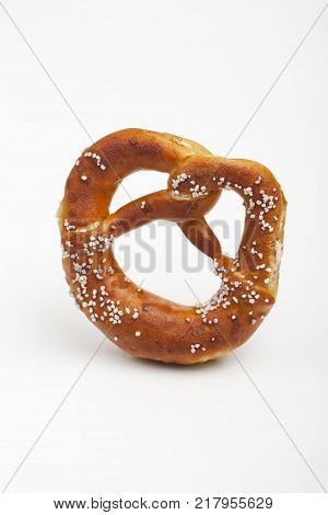 bavarian prezel with salt on white background