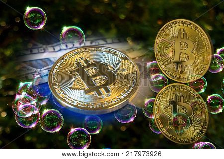 Bitcoin and a soap bubbles. Suitable for speculative bubble or market bubble concept.