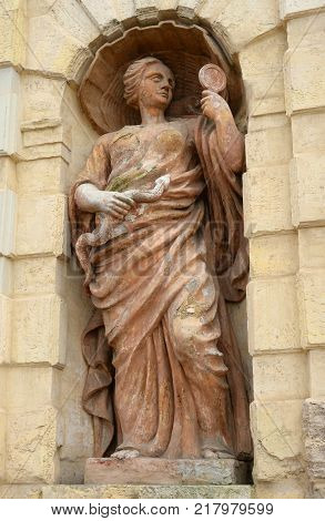 Statue symbolizing prudence near Petrovsky gate of the Peter and Paul Fortress in Saint Petersburg Russia.