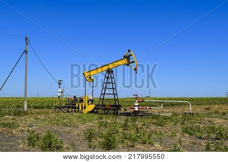 The Pumping Unit As The Oil Pump Installed On A Well. Equipment Of Oil Fields.