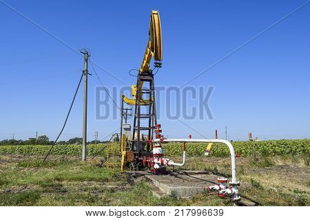 The Pumping Unit As The Oil Pump Installed On A Well. Equipment Of Oil Fields.