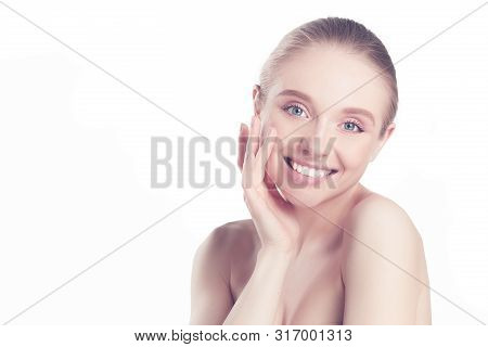 Portrait Of Beautiful Woman With Natural Make Up Touching Her Face.