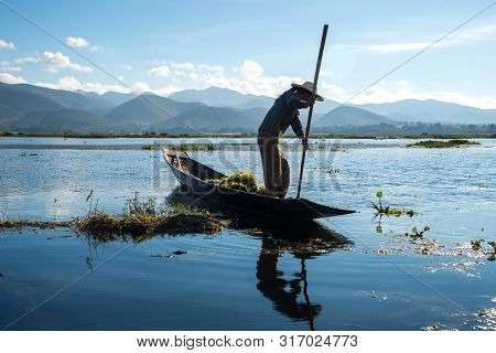 The Intha Woman (native People Living In This Lake) Fishing Fish In Inle Lake The Second Largest Lak