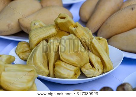 Fresh Jackfruit Slices On A White Plate. Sweet Yellow Jackfruit Ripe. Vegetarian, Vegan, Raw Food. E