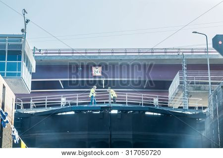 Lappeenranta, Finland - August 7, 2019: Lock And Bridge On The Saimaa Canal At Malkia. Engineers Are