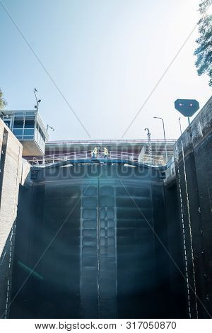 Lappeenranta, Finland - August 7, 2019: Lock And Bridge On The Saimaa Canal At Malkia. Engineers Are
