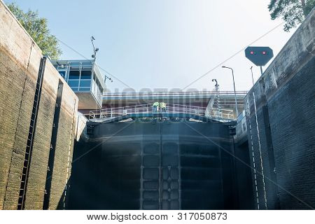 Lappeenranta, Finland - August 7, 2019: Lock And Bridge On The Saimaa Canal At Malkia. Engineers Are