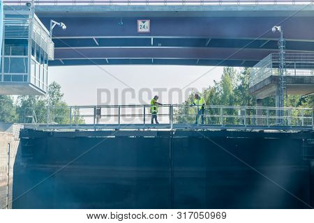 Lappeenranta, Finland - August 7, 2019: Lock And Bridge On The Saimaa Canal At Malkia. Engineers Are