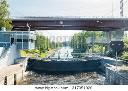 Lappeenranta, Finland - August 7, 2019: Lock And Bridge On The Saimaa Canal At Malkia. Engineers Are