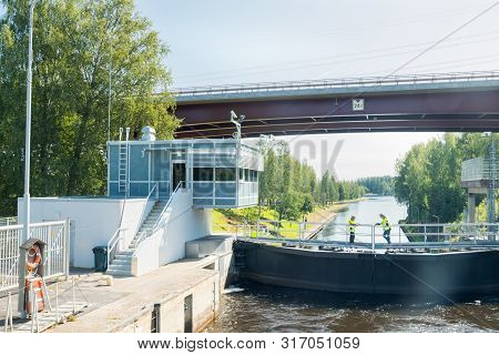 Lappeenranta, Finland - August 7, 2019: Lock And Bridge On The Saimaa Canal At Malkia. Engineers Are