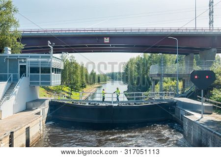 Lappeenranta, Finland - August 7, 2019: Lock And Bridge On The Saimaa Canal At Malkia. Engineers Are