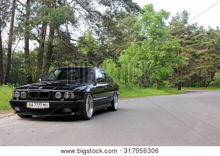 Kiev, Ukraine. May 17, 2014. Bmw M5 (e34) Against The Background Of The Forest. On The Bmw Wheels Sc