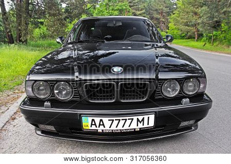 Kiev, Ukraine. May 17, 2014. Bmw M5 (e34) Against The Background Of The Forest. On The Bmw Wheels Sc