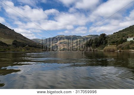Scenic View Of The Douro River And Valley With Terraced Vineyards Near The Tua Village, In Portugal.