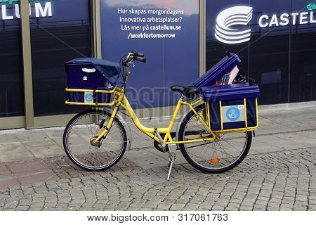 Malmo, Sweden - July 22, 2019: Yellow Swedish Postal Service Delivery Bicycle.