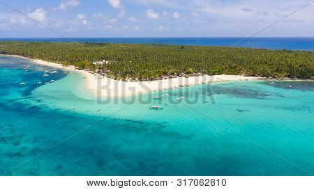 Seascape With A Beautiful Island. Daco Island, Philippines. Tropical Island With A White Sandy Beach