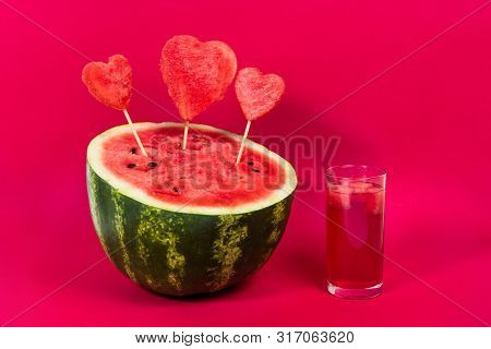 Useful Watermelon Juice With A Tube And A Large Ripe Watermelon Decorated With Hearts On Sticks On A
