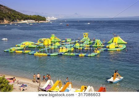 Bol, Croatia - August 06, 2019: Water Fun Park On A Zlatni Rat Beach In Bol On The Island Of Brac