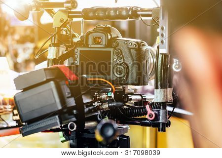 Film Industry. Cameraman Shooting Film Scene With Camera
