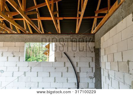 Roof Trusses Covered With A Membrane On A Detached House Under Construction, Visible Roof Elements, 