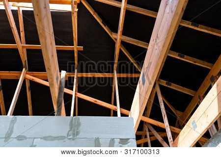 Roof Trusses Covered With A Membrane On A Detached House Under Construction, Visible Roof Elements, 