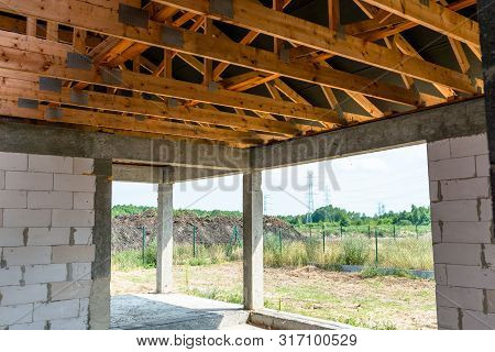 Roof Trusses Covered With A Membrane On A Detached House Under Construction, Visible Roof Elements, 