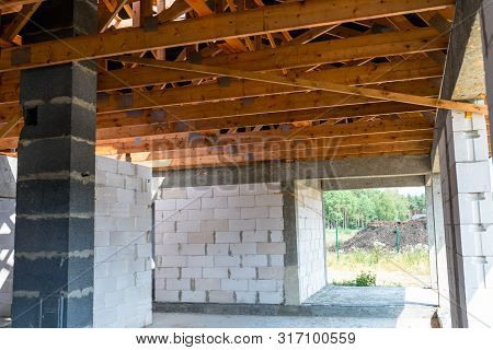 Roof Trusses Covered With A Membrane On A Detached House Under Construction, Visible Roof Elements, 